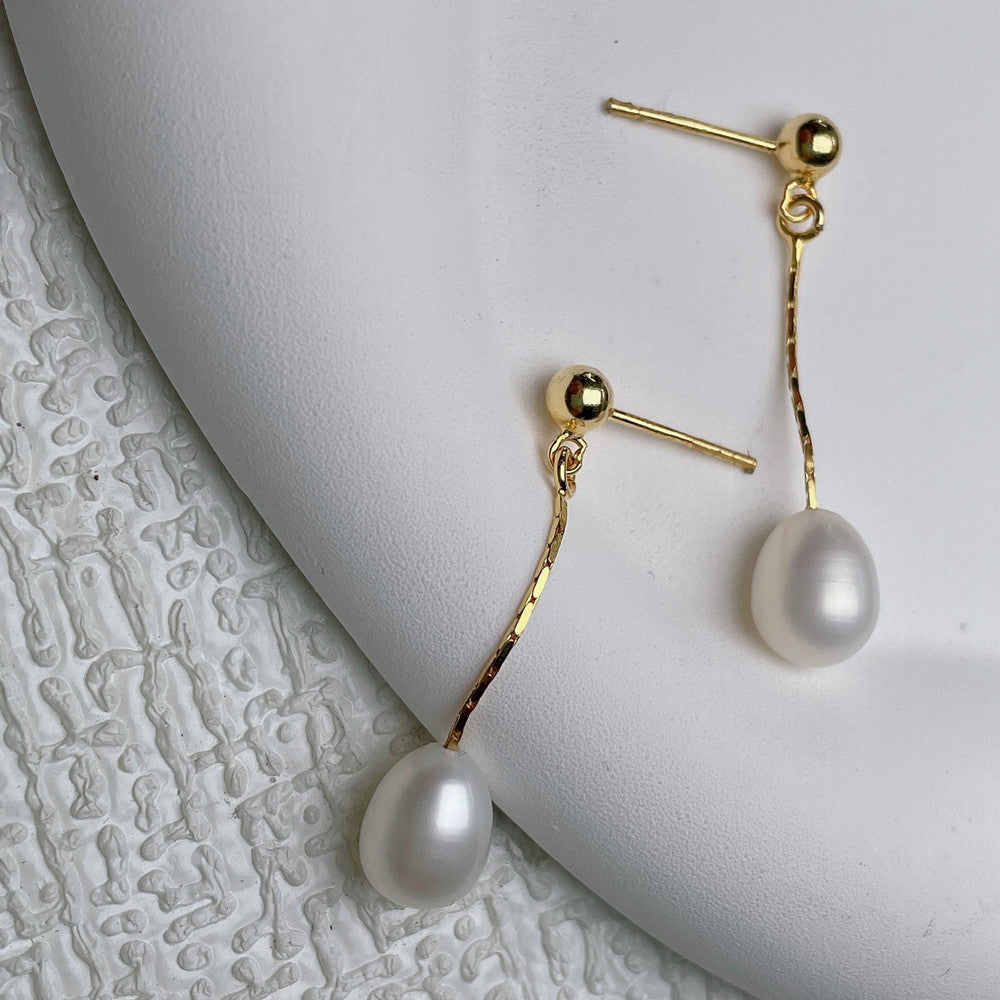 Élégantes boucles d'oreilles en perles
