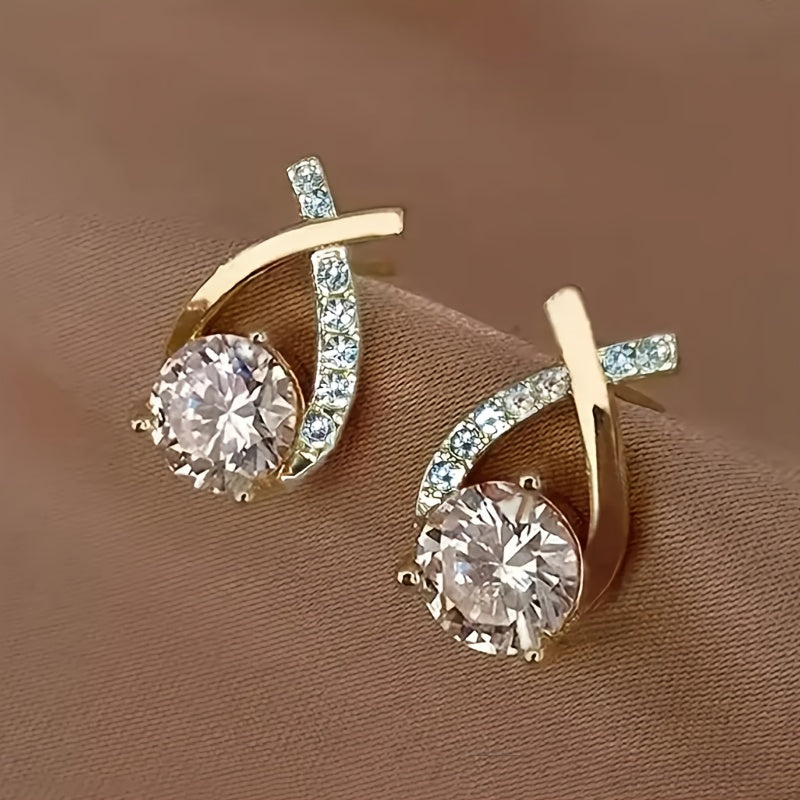Puces d'oreilles avec croix dorée et zirconiums