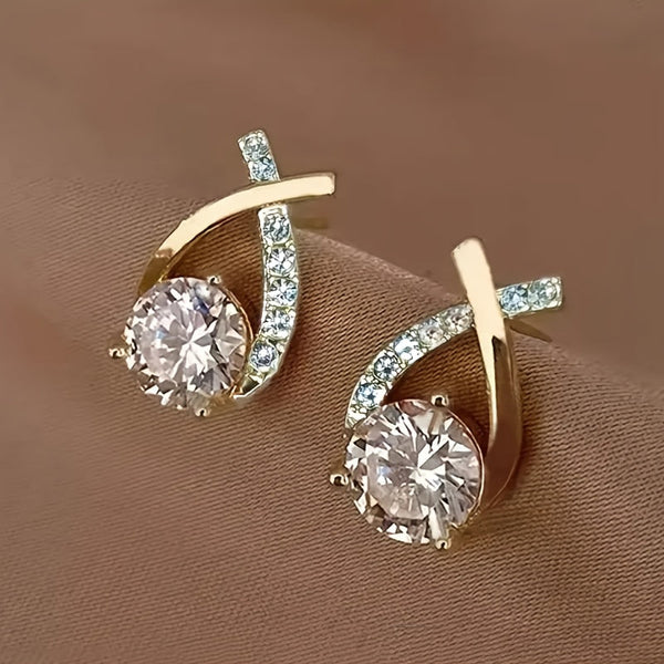 Puces d'oreilles avec croix dorée et zirconiums